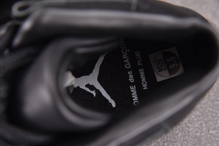 Comme des Garçons x Air Jordan 11 “Triple Black” IV7639-001